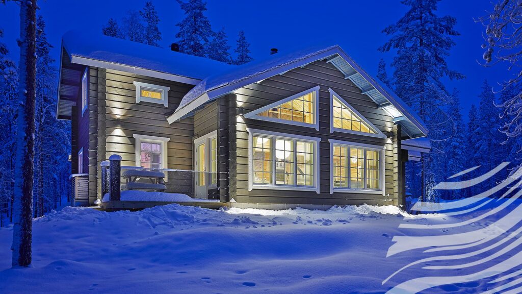 Kuva hirsitalosta talvimaisemassa